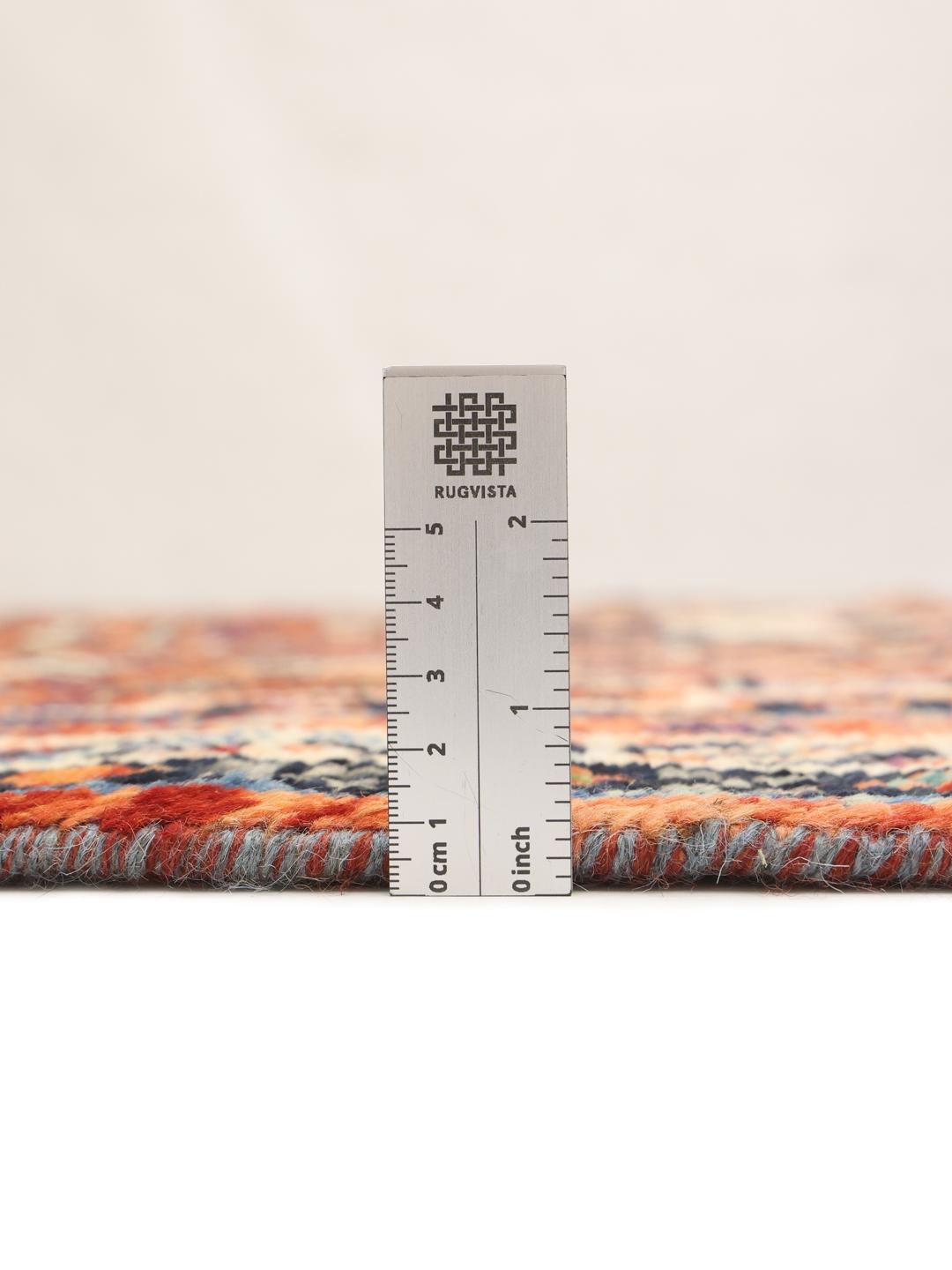 Hand-knotted Kazak rug from Afghanistan with vibrant multicolor geometric patterns