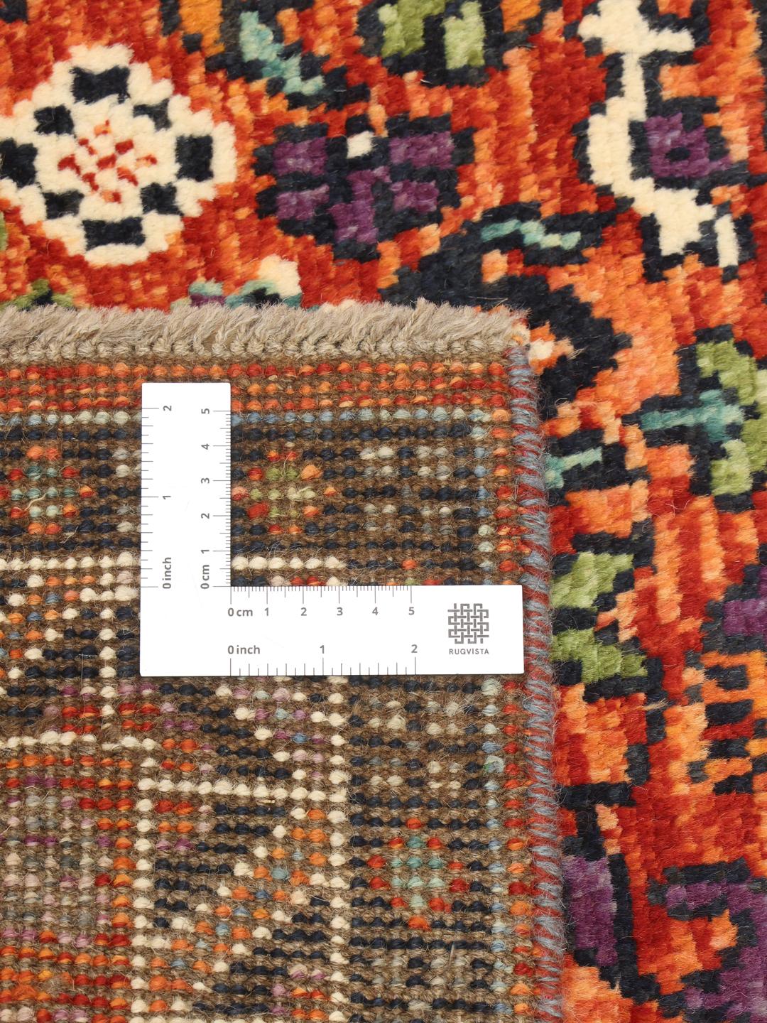 Hand-knotted Kazak rug from Afghanistan with vibrant multicolor geometric patterns
