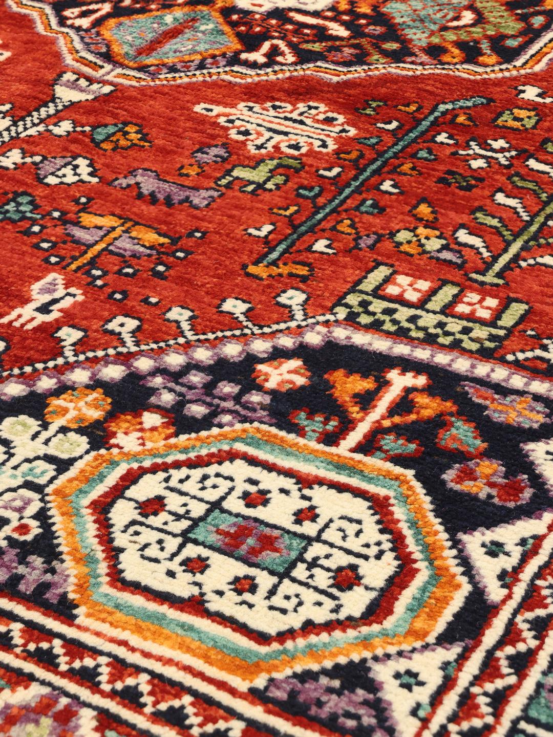 Hand knotted Afghan Kazak rug in red and blue with geometric patterns