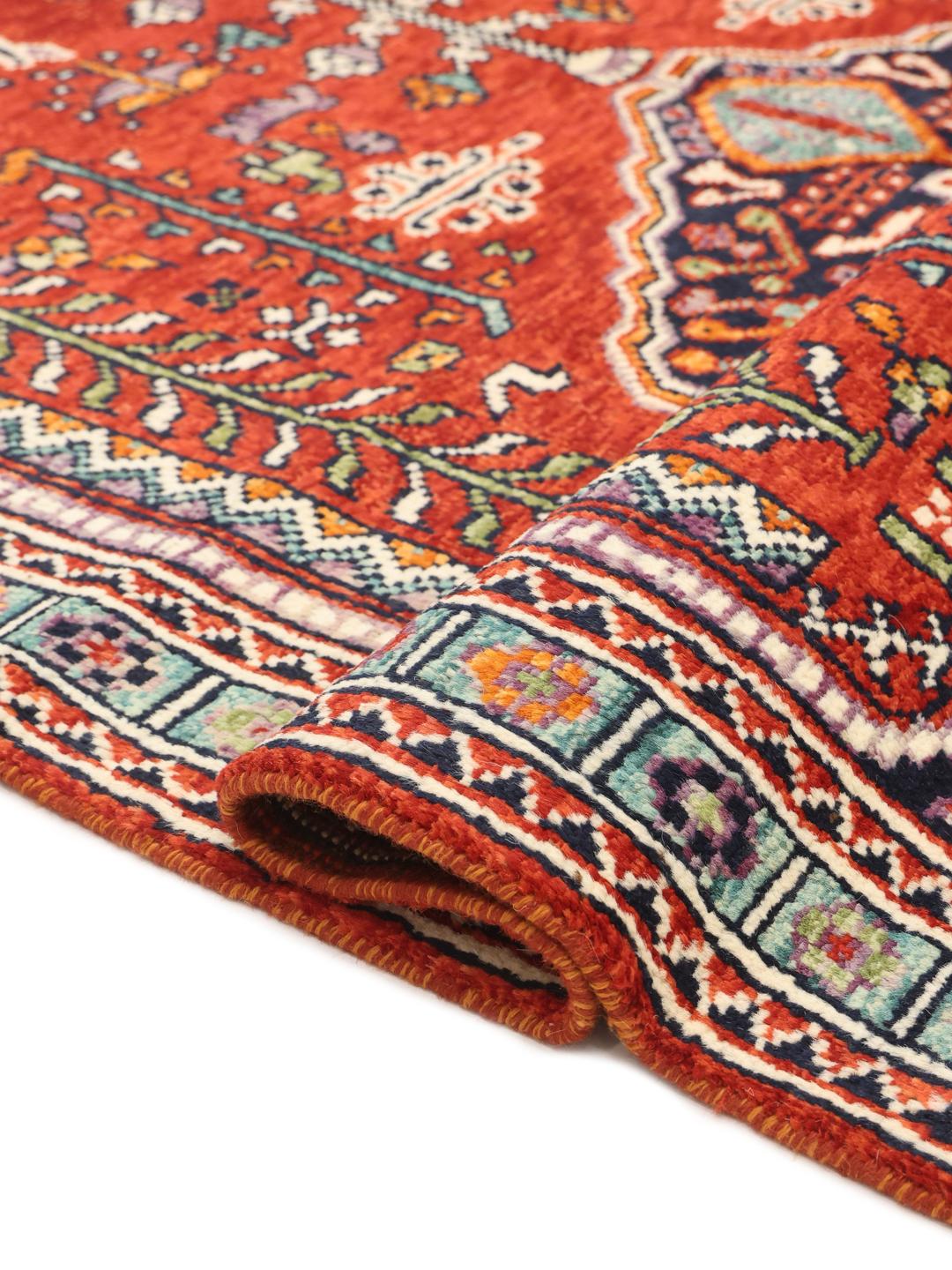 Hand knotted Afghan Kazak rug in red and blue with geometric patterns
