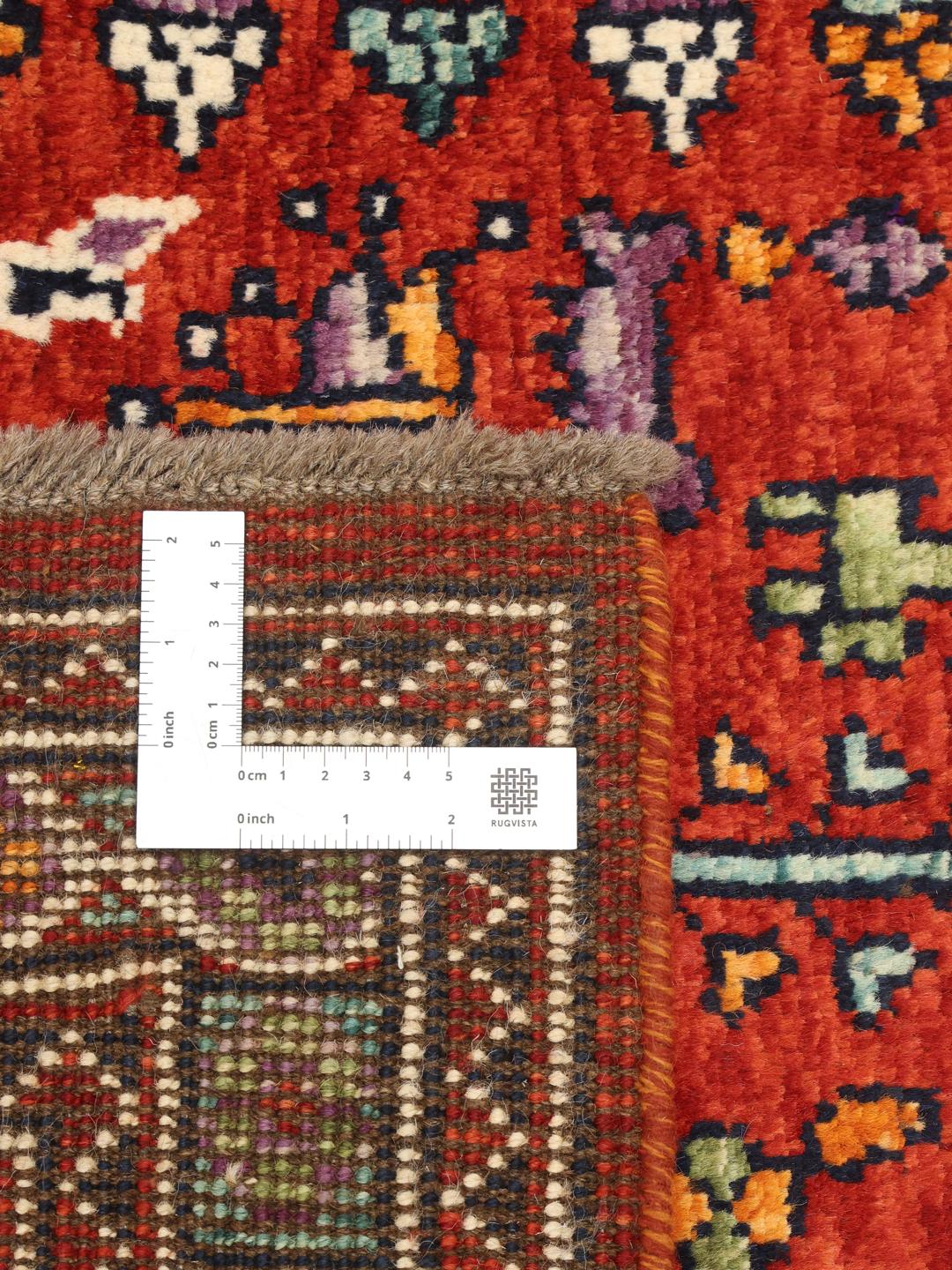 Hand knotted Afghan Kazak rug in red and blue with geometric patterns