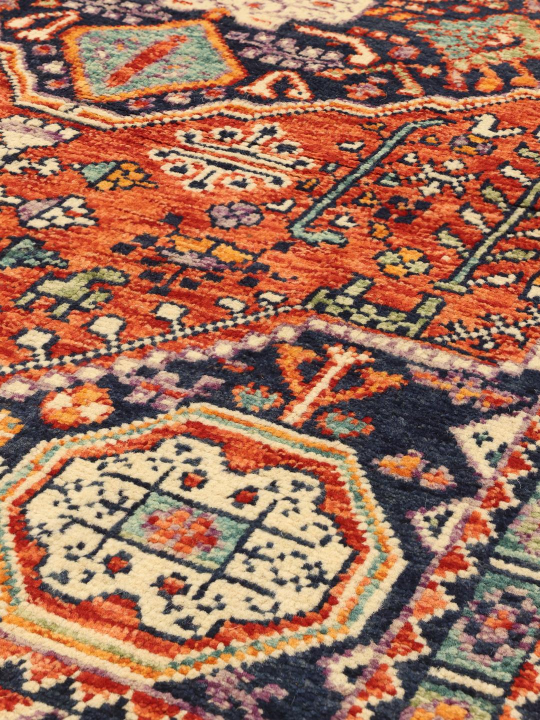 Hand-knotted Afghan Kazak rug with red and blue geometric patterns