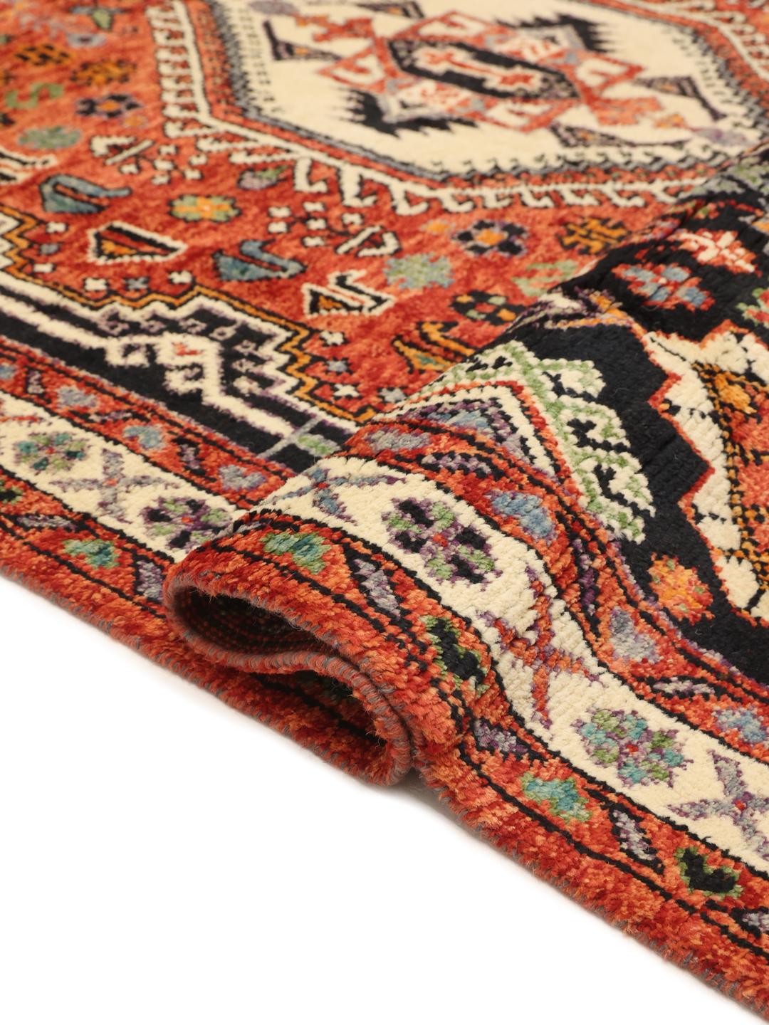 Handgeknüpfter Kazak-Teppich aus Afghanistan mit geometrischen Mustern aus mehrfarbiger Wolle.
