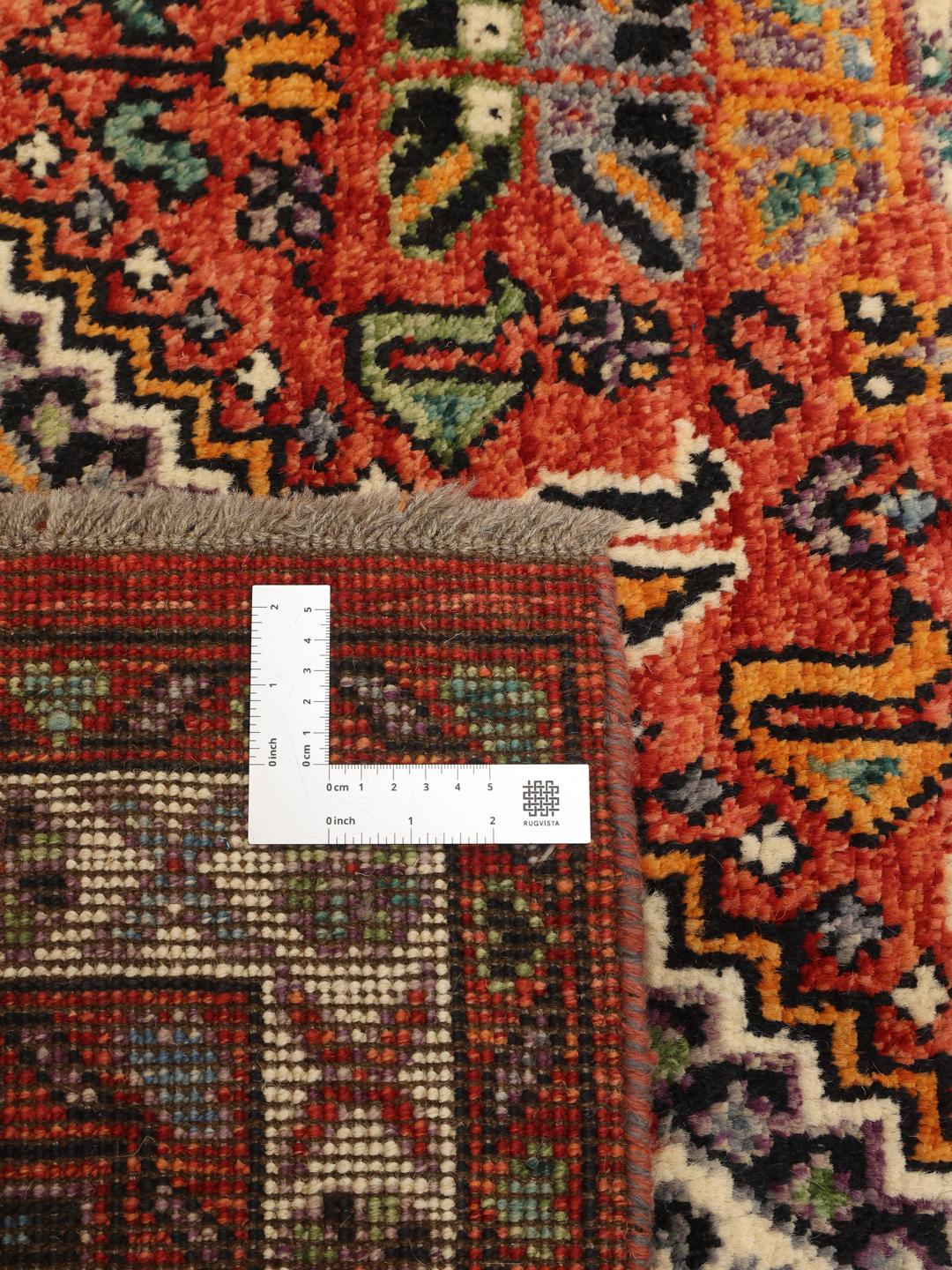 Handgeknüpfter Kazak-Teppich aus Afghanistan mit geometrischen Mustern aus mehrfarbiger Wolle.