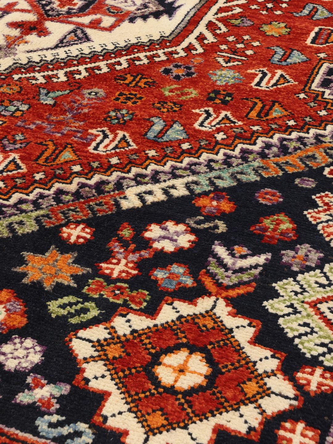 Kazak Teppich aus Afghanistan in Dunkelblau und Rottönen