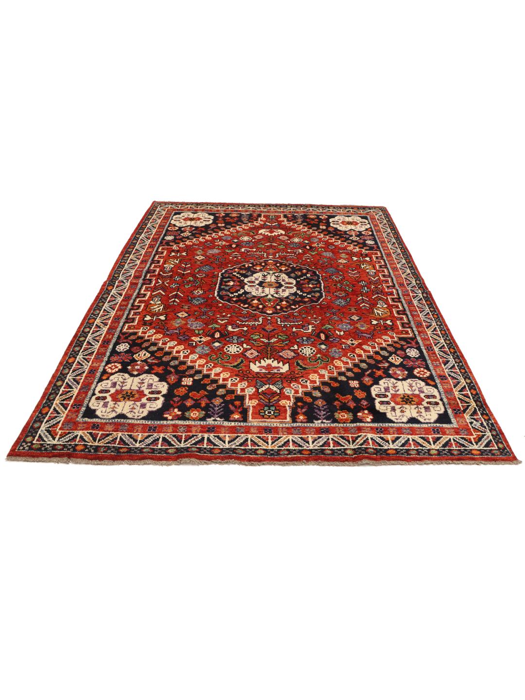 Hand-knotted Kazak rug from Afghanistan featuring a deep red and blue geometric design.