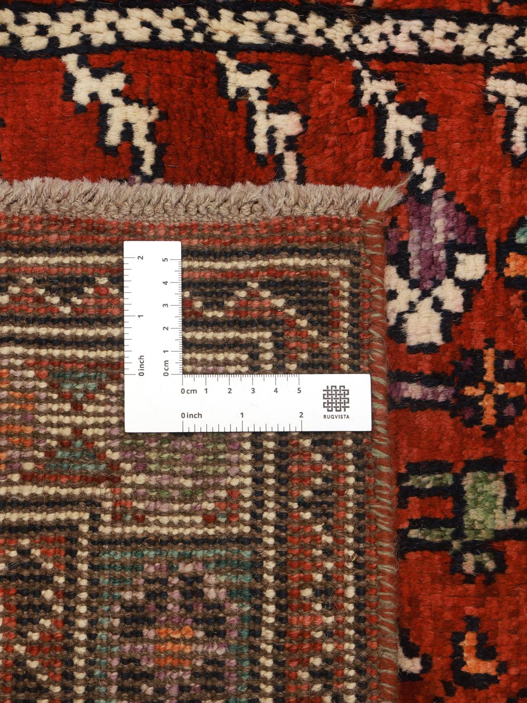 Hand-knotted Kazak rug from Afghanistan in red and blue
