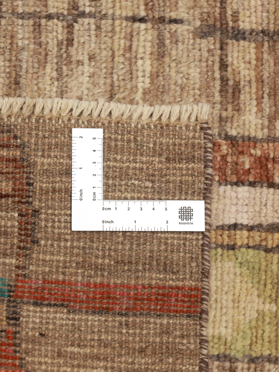 Håndknyttet løber fra Afghanistan med et farverigt abstrakt design i uld