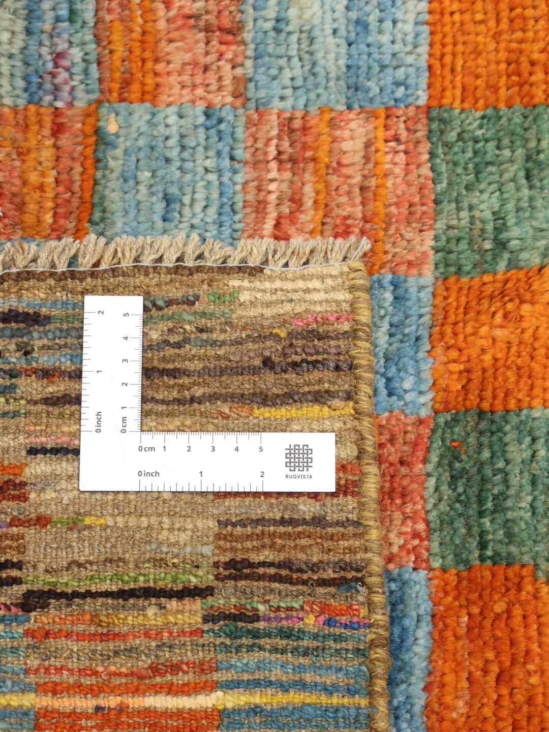Hand-knotted Afghan runner with a vibrant multicolor checkered pattern