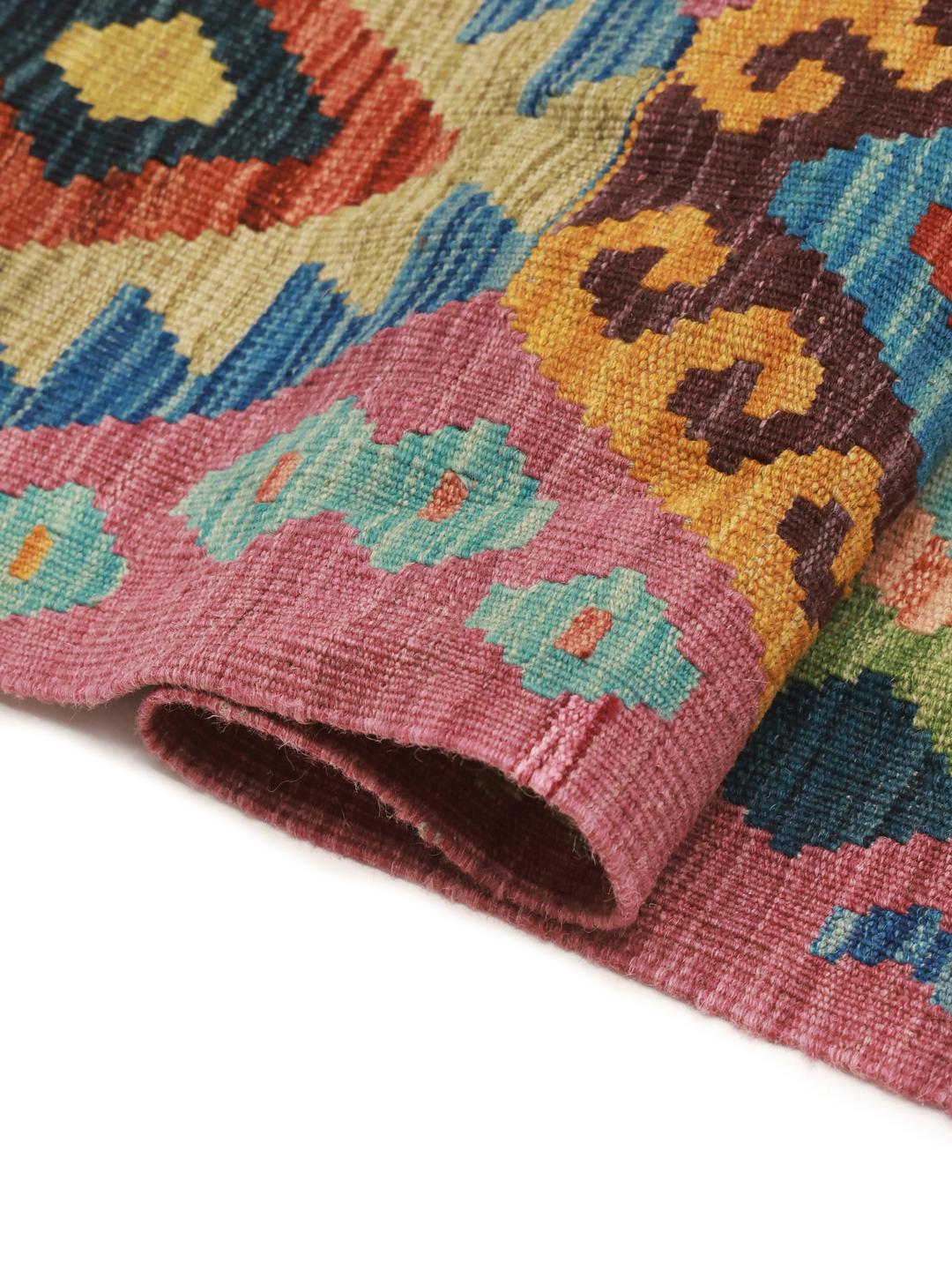 Hand-woven Afghan Kelim rug featuring a vibrant multicolor geometric diamond pattern