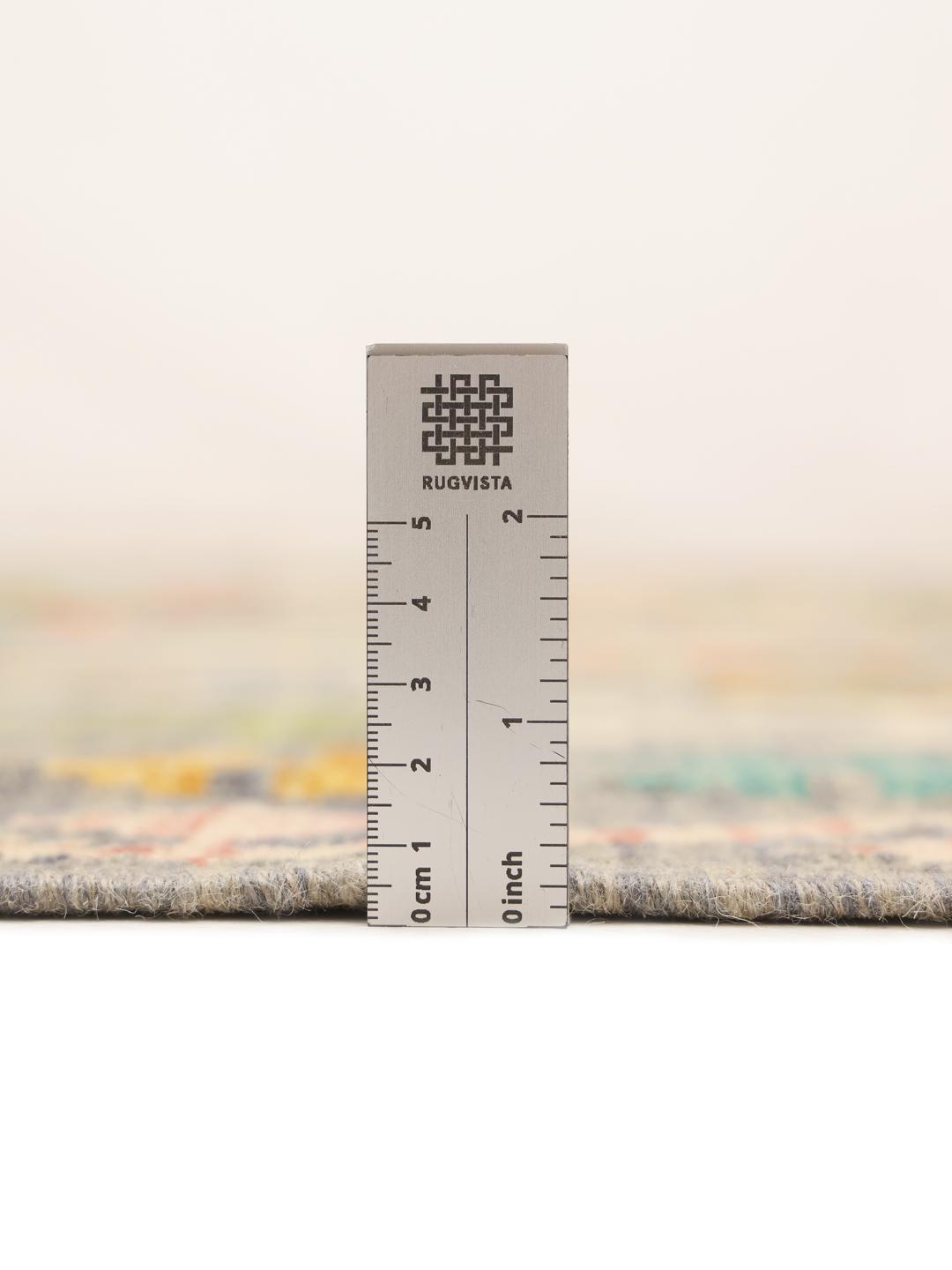 Hand-woven Kelim rug from Afghanistan with a multicolor geometric pattern on a grey background