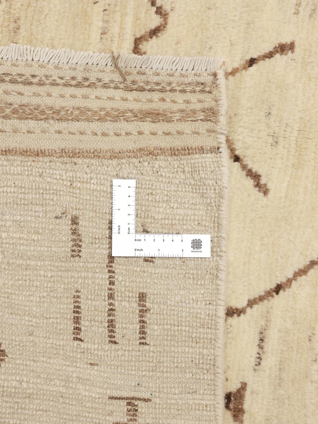 Hand-knotted Afghan wool rug with tribal motifs in a neutral beige tone