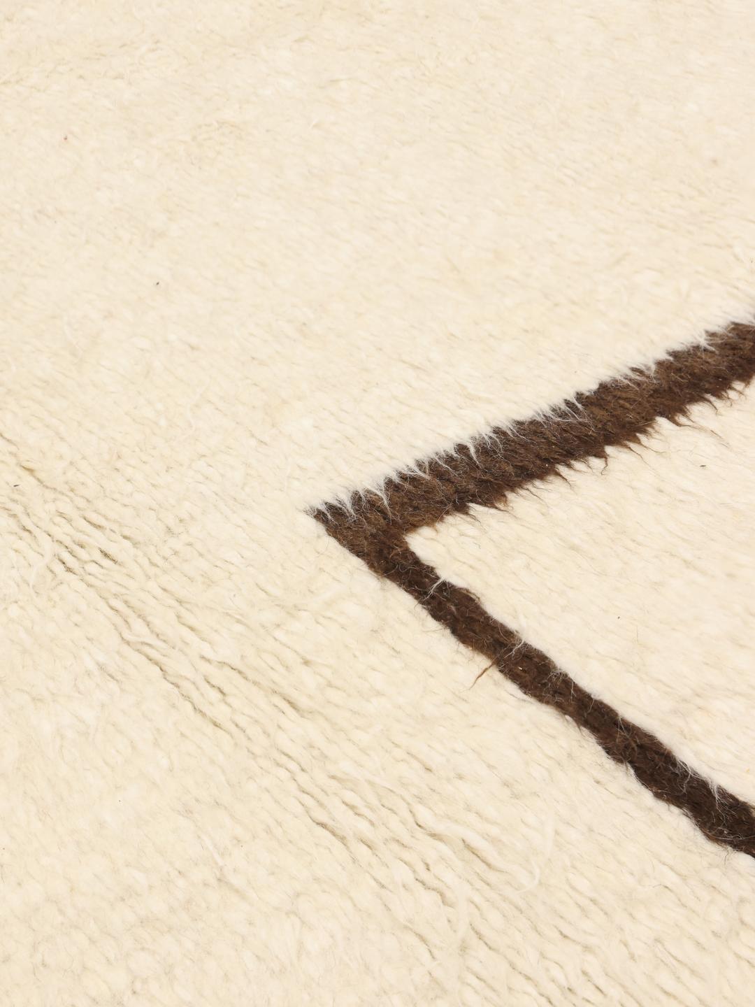 Hand-knotted Afghan rug with minimalist brown lines on a beige background