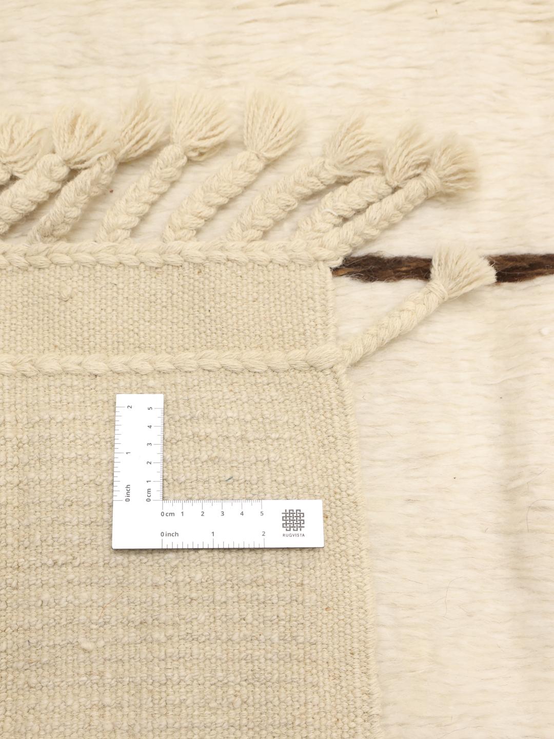 Hand-knotted Afghan rug with minimalist brown lines on a beige background