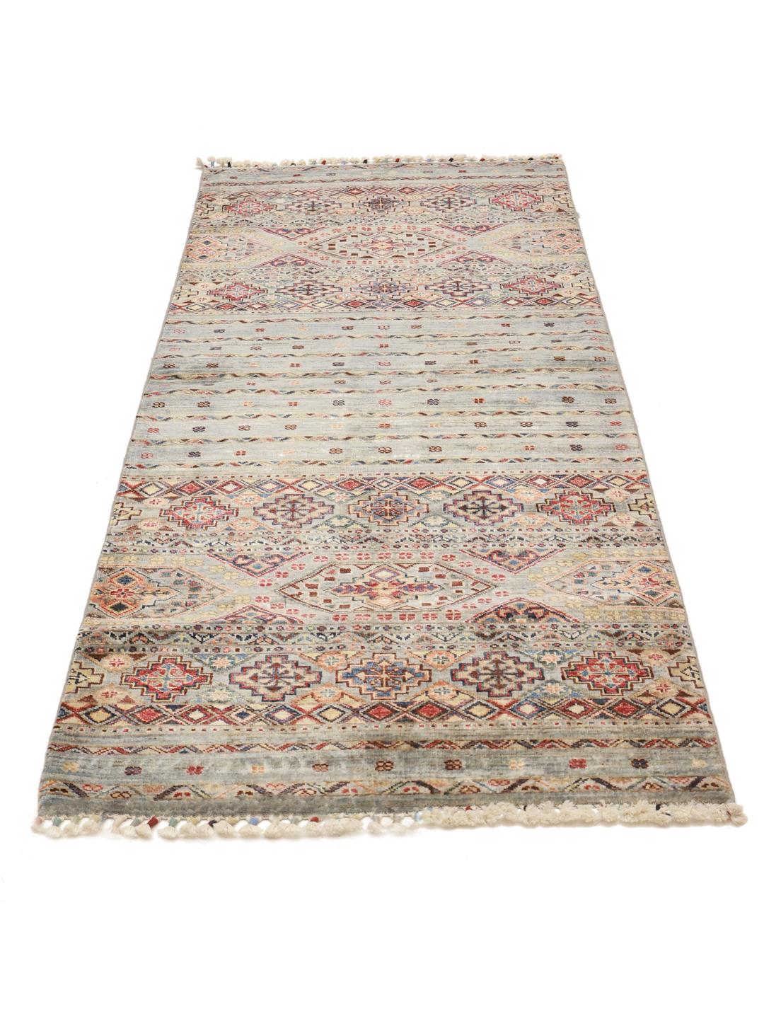 Hand-knotted runner from Afghanistan with blue and red geometric patterns.