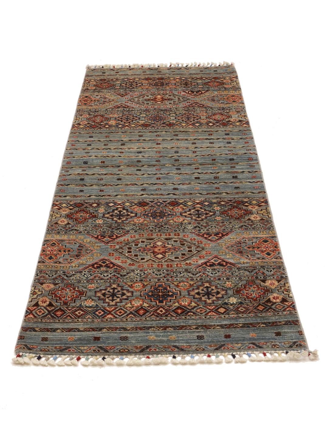 Hand-knotted runner from Afghanistan with blue and red geometric patterns.