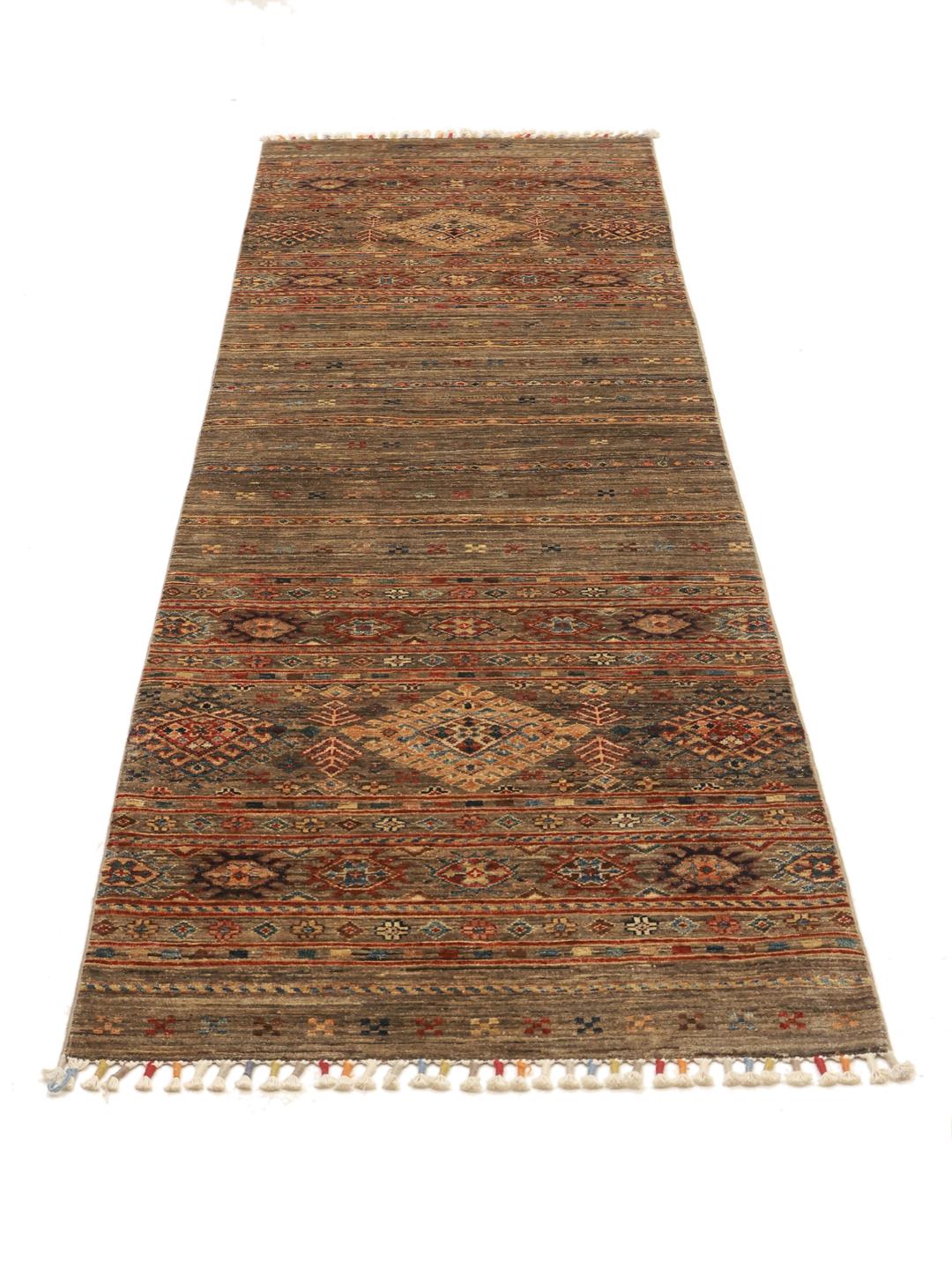Hand-knotted brown runner rug from Afghanistan with geometric tribal patterns.