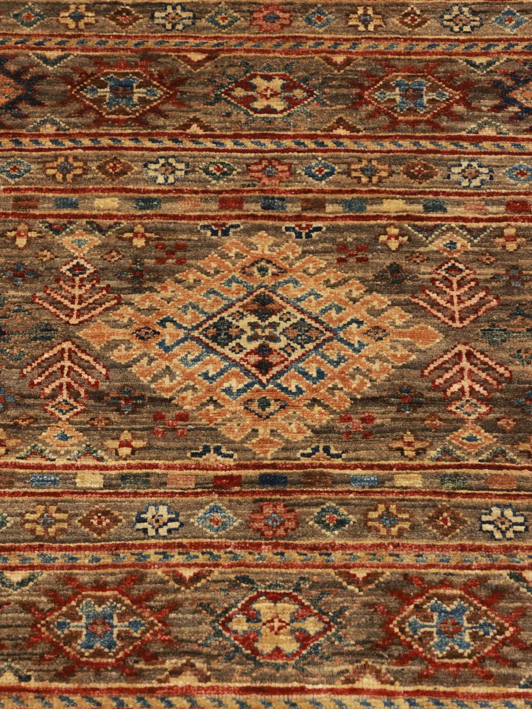 Hand-knotted brown runner rug from Afghanistan with geometric tribal patterns.