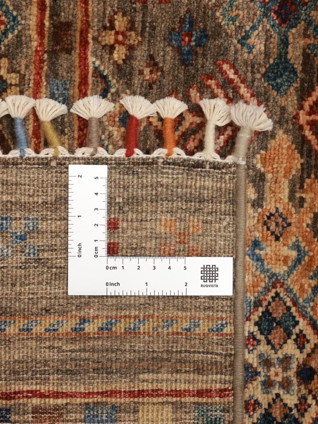 Hand-knotted brown runner rug from Afghanistan with geometric tribal patterns.