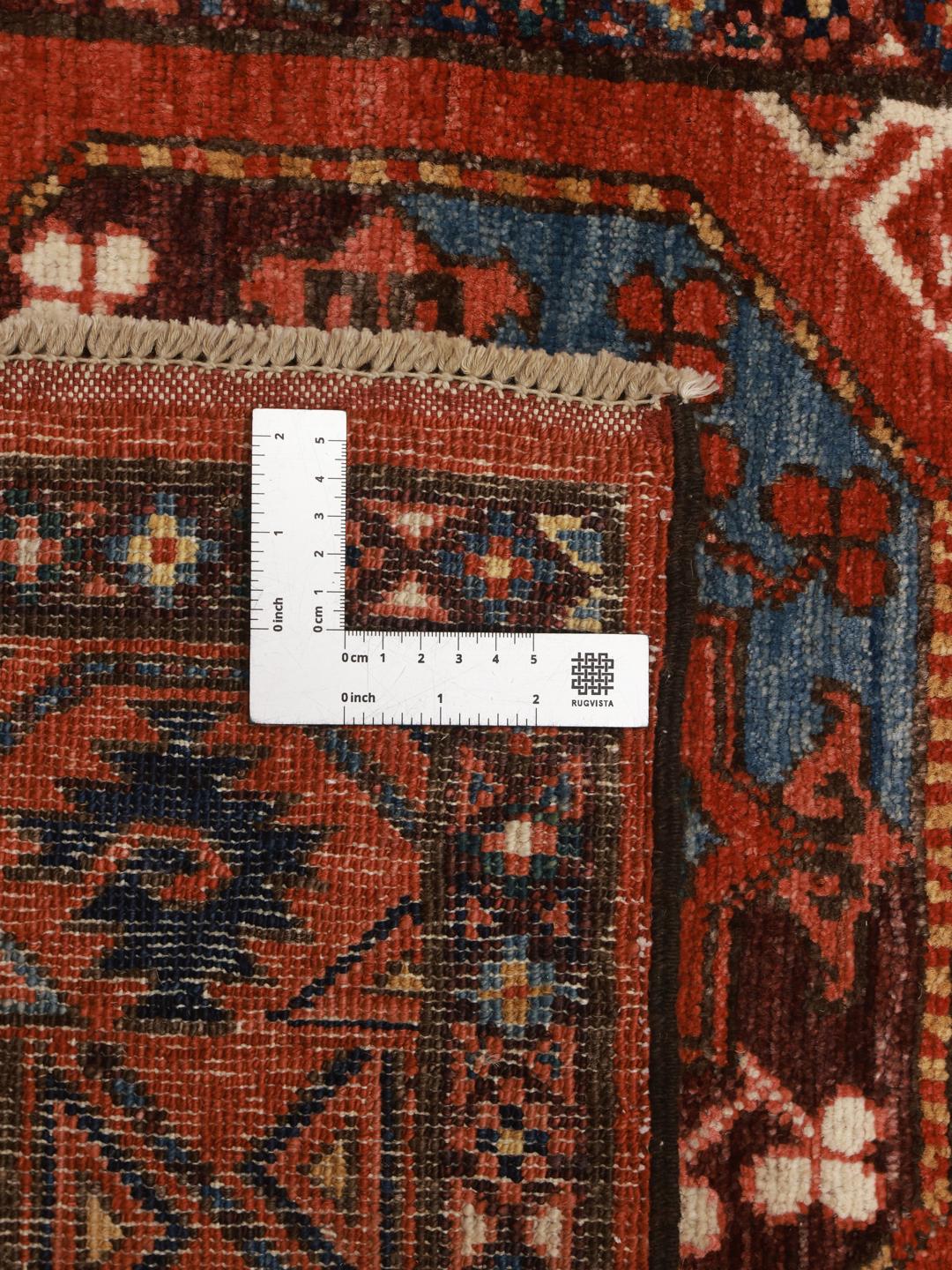 Håndknyttet afghansk løber i rød med geometriske motiver