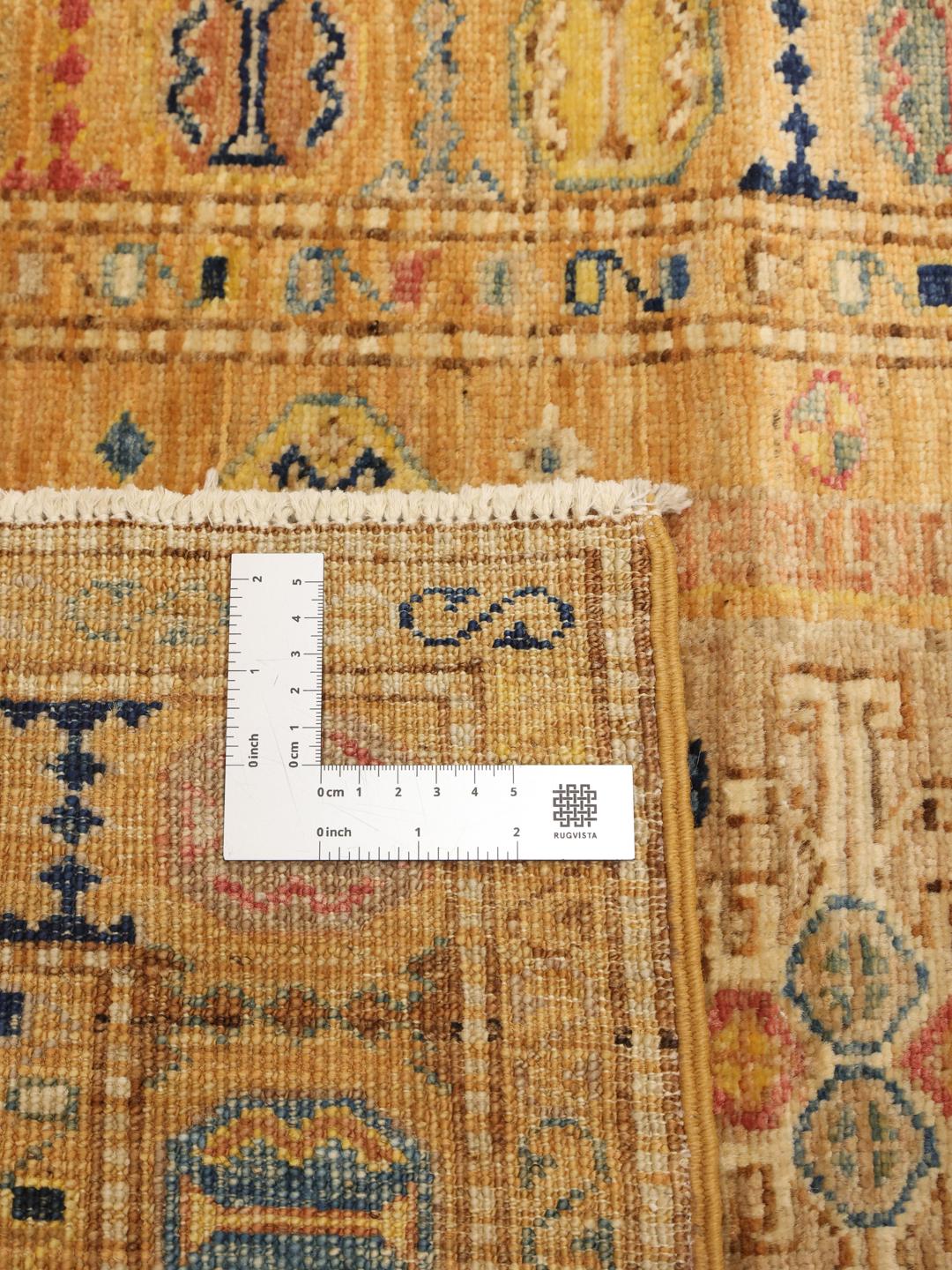 Hand-knotted Kazak Ariana runner with geometric medallions in red, blue, and gold tones from the Middle East.