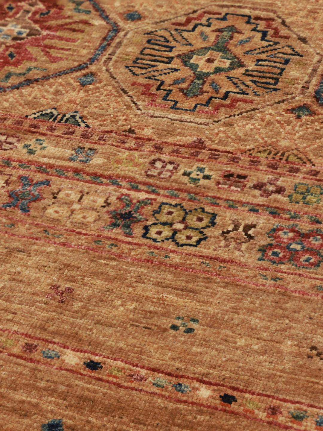 Handmade Afghan rug in beige with traditional patterns