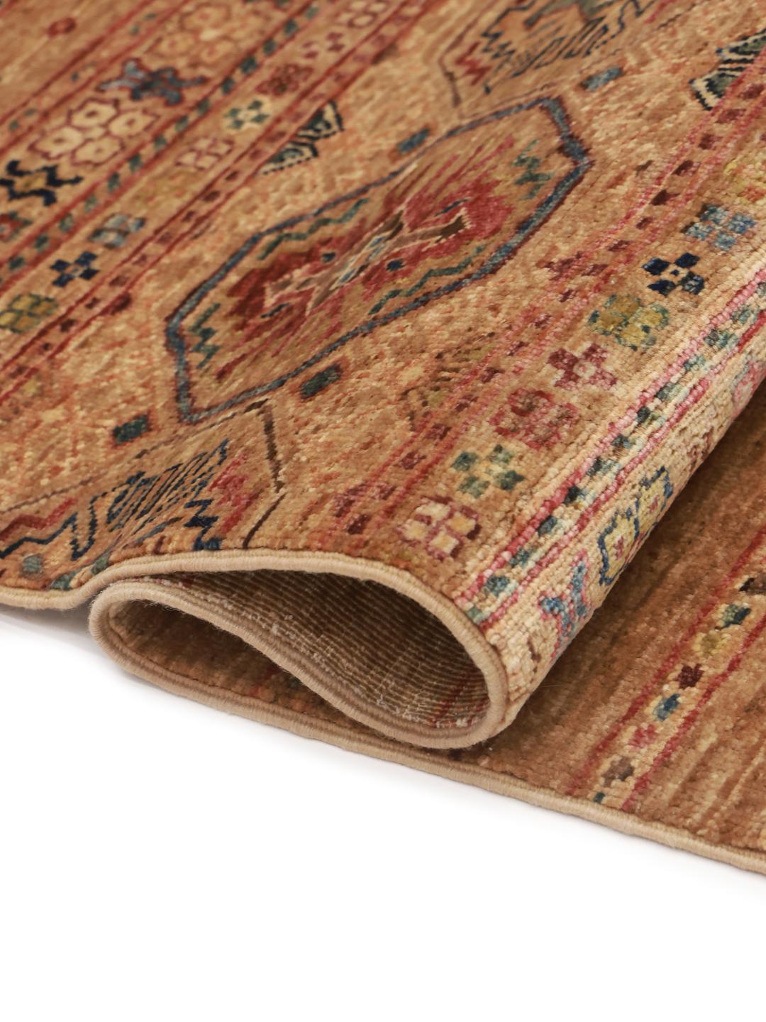 Handmade Afghan rug in beige with traditional patterns