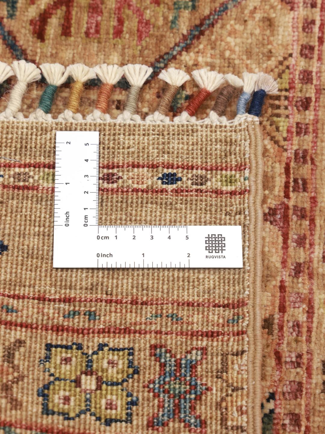 Handmade Afghan rug in beige with traditional patterns