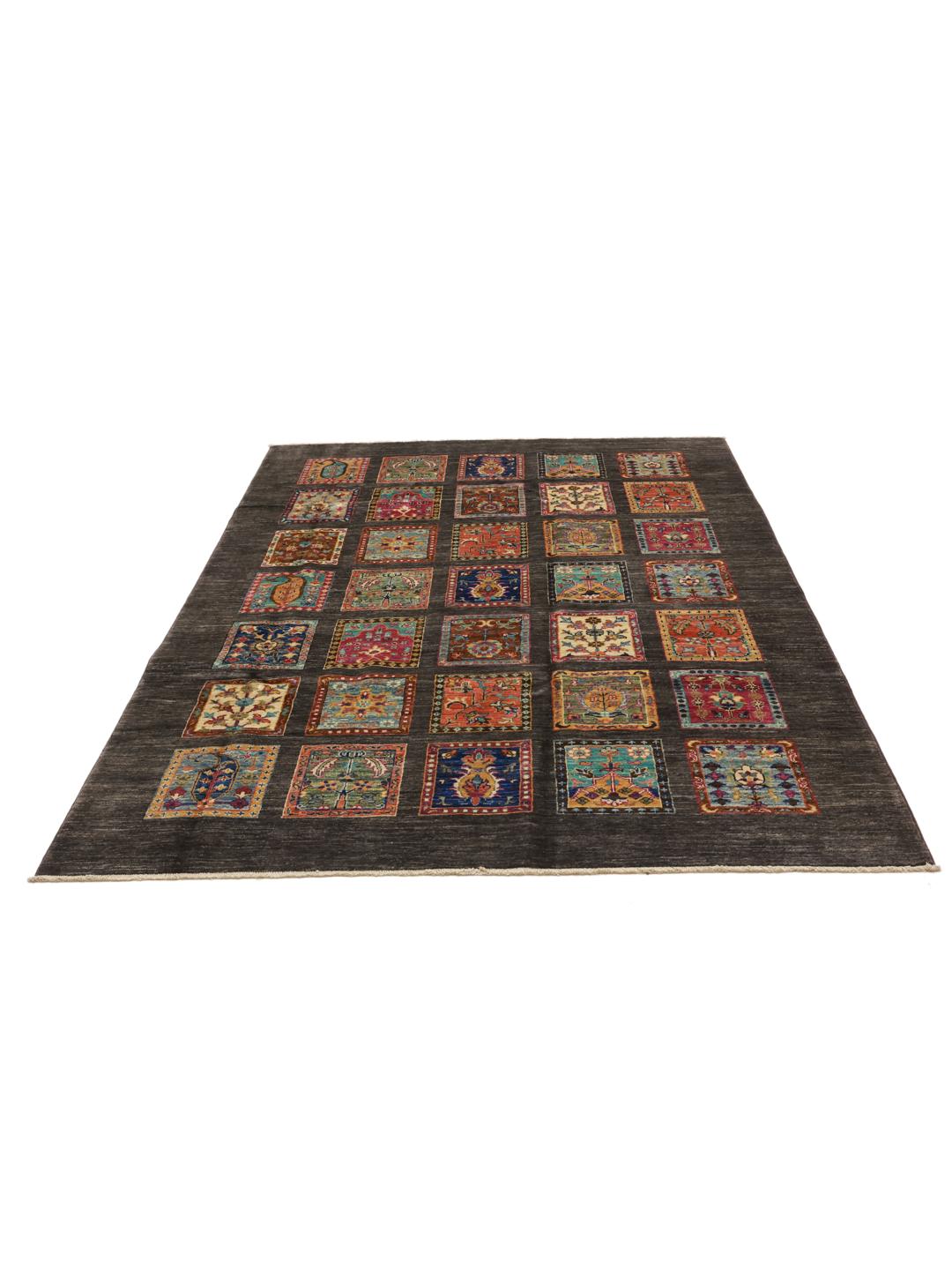 Hand-knotted rug from the Middle East featuring a dark field with colourful decorative panels.