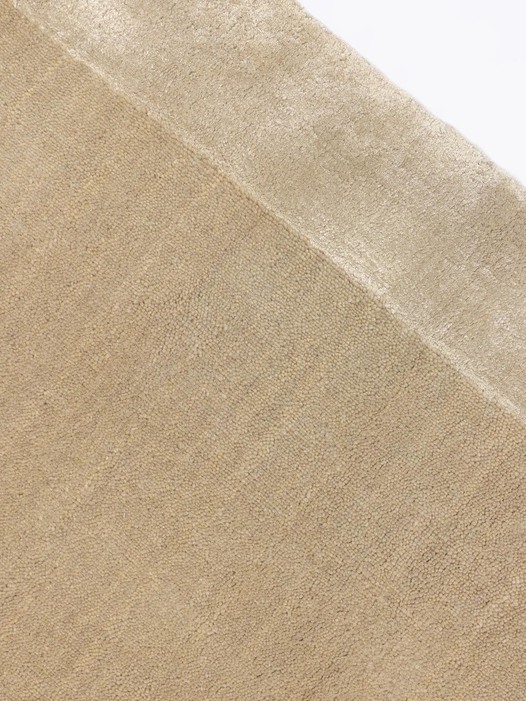 Beige tapijt met een zachte handloom textuur