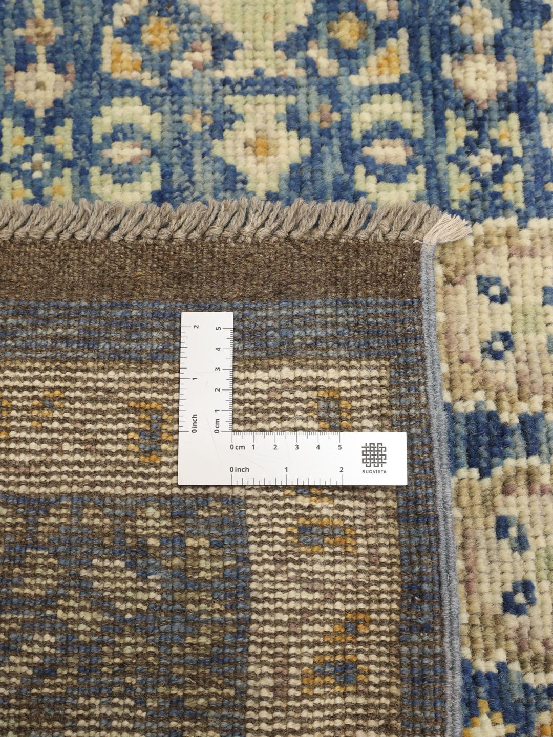 Handgeknoopt Afghaans Usak-tapijt in het blauw met sierlijke bloempatronen