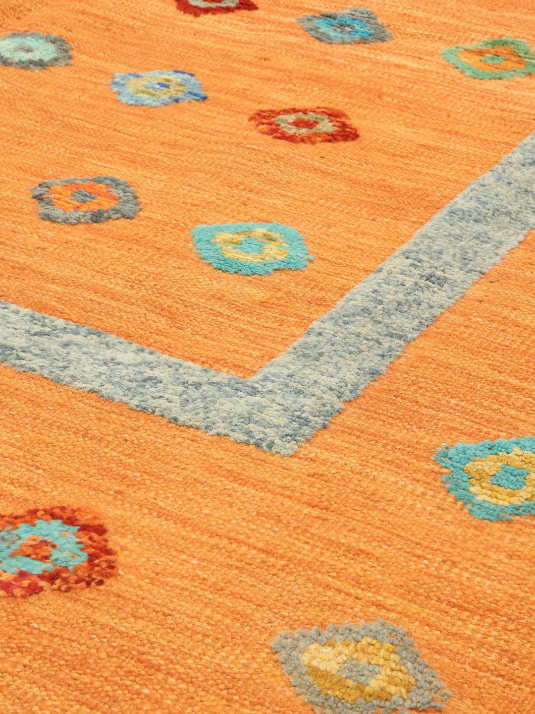 Hand-woven Afghan Kelim Nimbaft rug in vibrant orange with multi-coloured diamond patterns