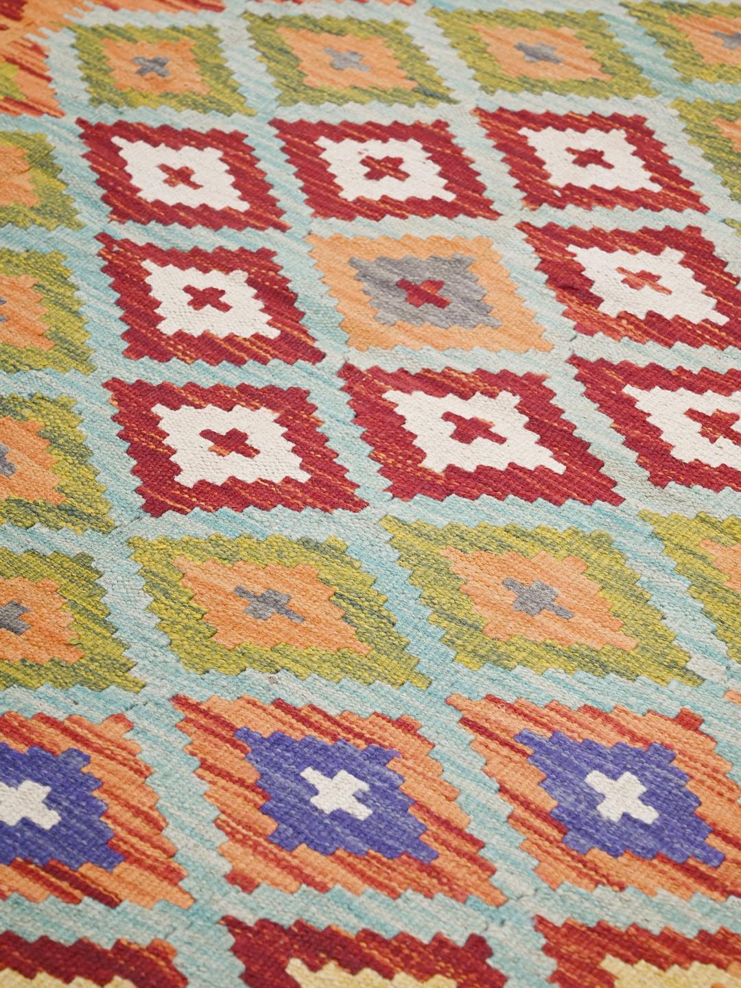 Hand-woven Afghan Kelim rug with geometric patterns in multicolor wool
