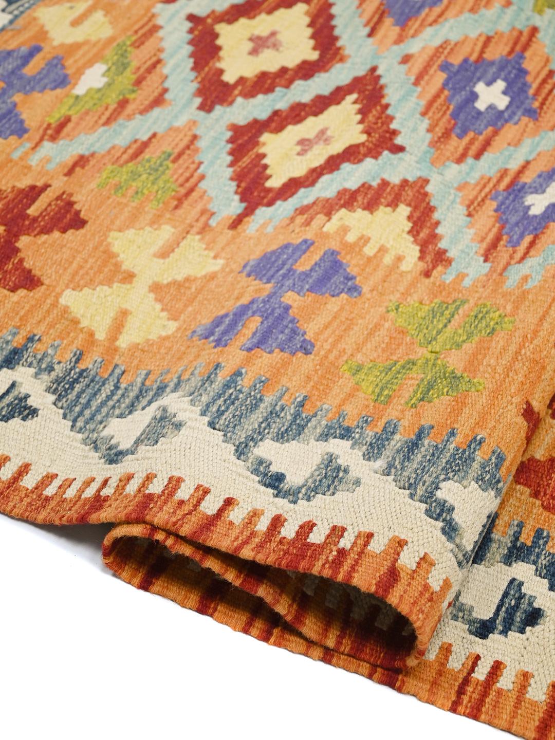 Hand-woven Afghan Kelim rug with geometric patterns in multicolor wool