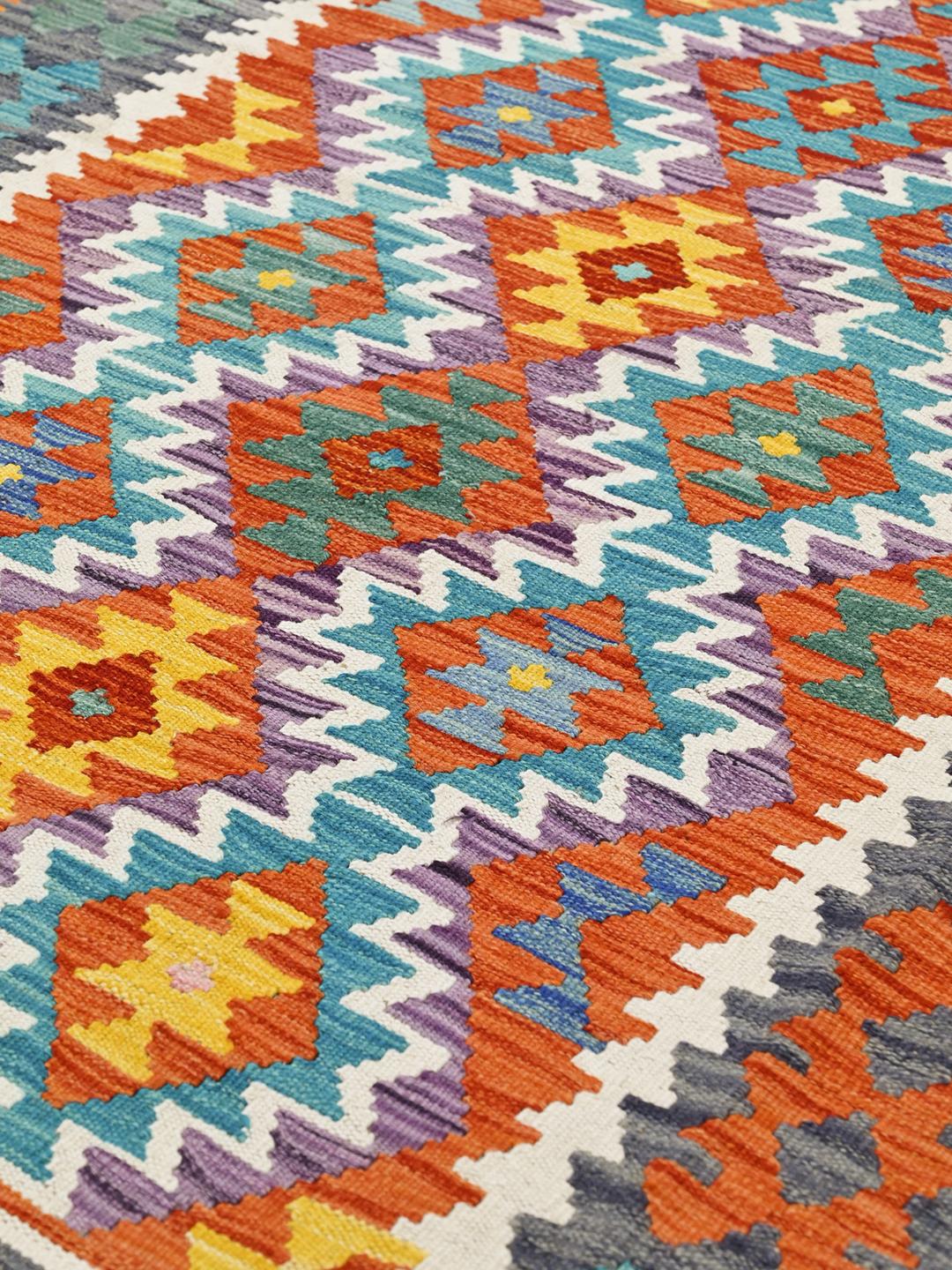 Hand-woven Afghan Kelim rug featuring a multicolor geometric pattern
