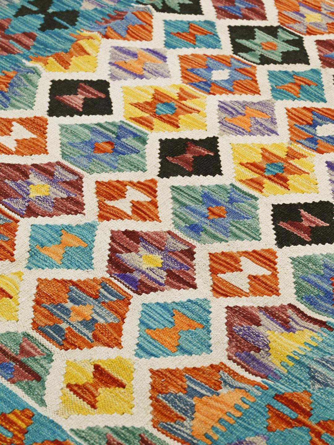 Hand-woven Afghan Kelim rug featuring a vibrant multicolor geometric pattern