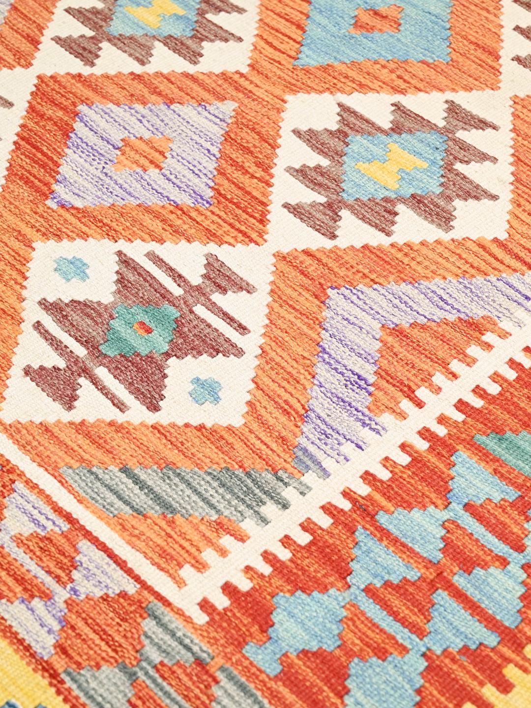 Hand-woven Afghan Kelim rug with geometric patterns in multicolour wool