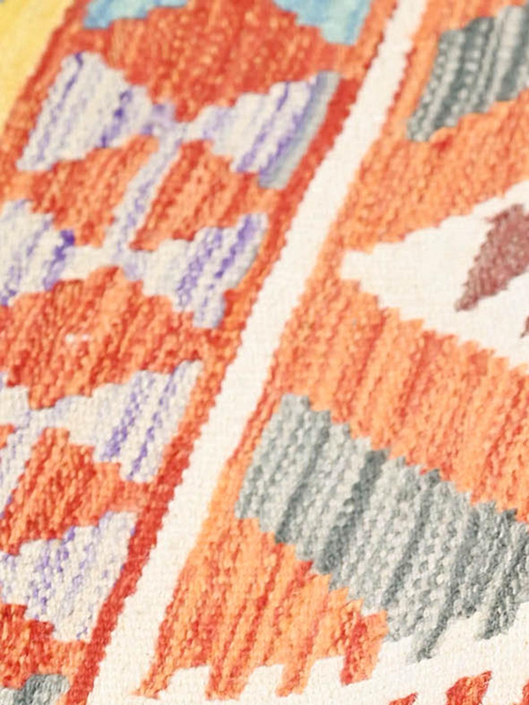 Hand-woven Afghan Kelim rug with geometric patterns in multicolour wool