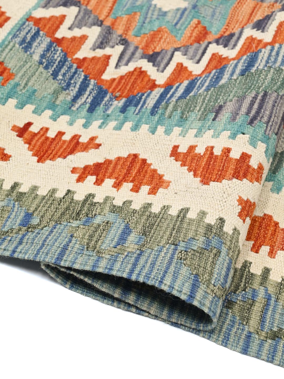 A hand-woven Kelim Afghan Old Style rug featuring vibrant geometric patterns and multicolor Wool.