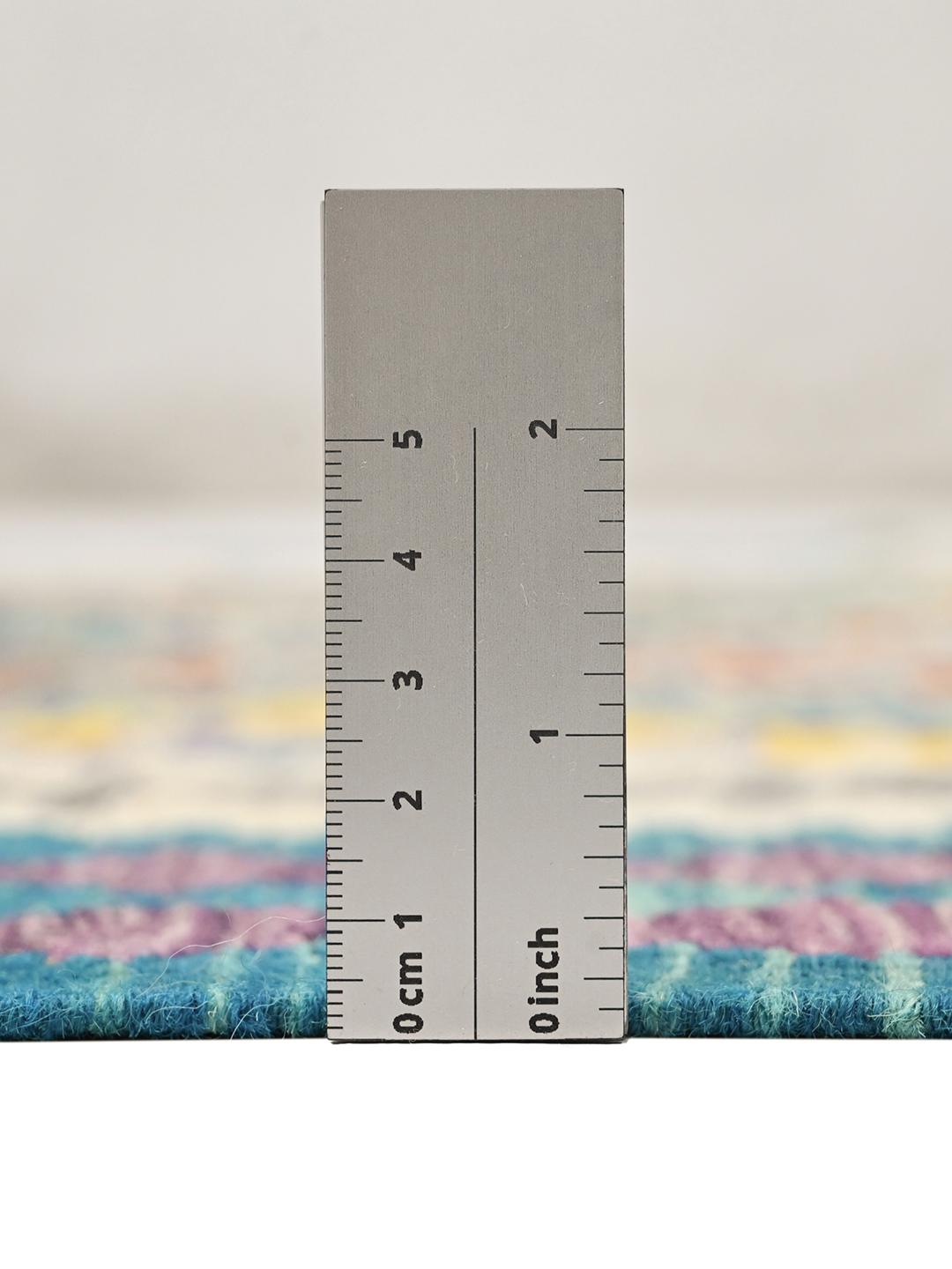 A hand-woven Kelim Afghan rug from the Middle East with vibrant multicolor geometric patterns.