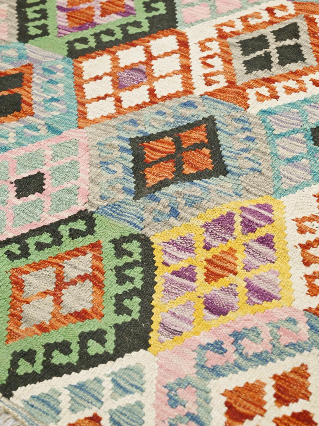 Hand-woven Afghan Kelim rug with a vibrant geometric diamond pattern in multicolor Wool