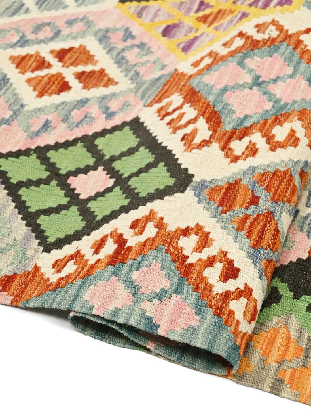 Hand-woven Afghan Kelim rug with a vibrant geometric diamond pattern in multicolor Wool
