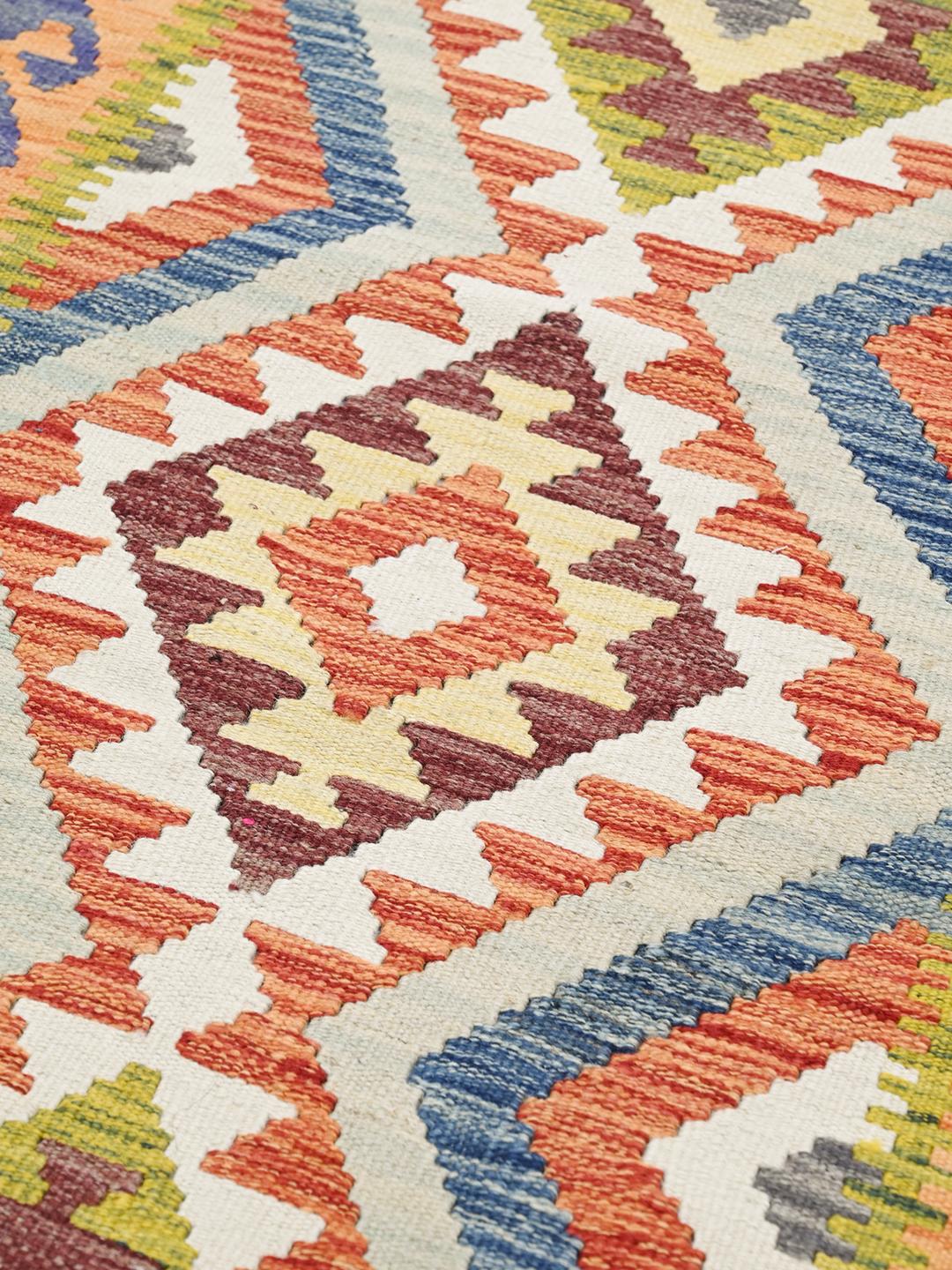Handmade Afghan runner with vibrant multicolor geometric diamond patterns