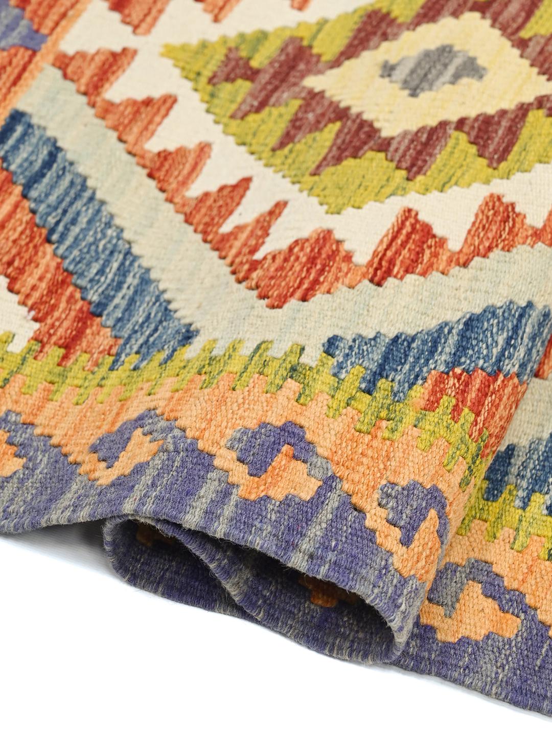 Handmade Afghan runner with vibrant multicolor geometric diamond patterns