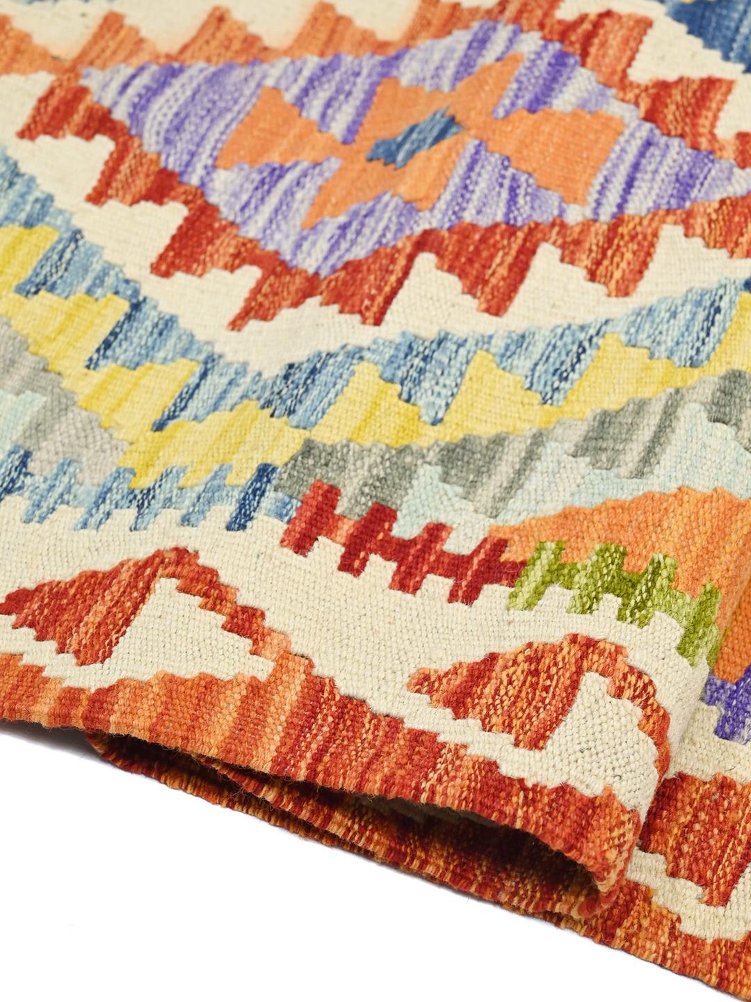 Hand-woven Afghan runner featuring vibrant geometric patterns in a multicolor palette