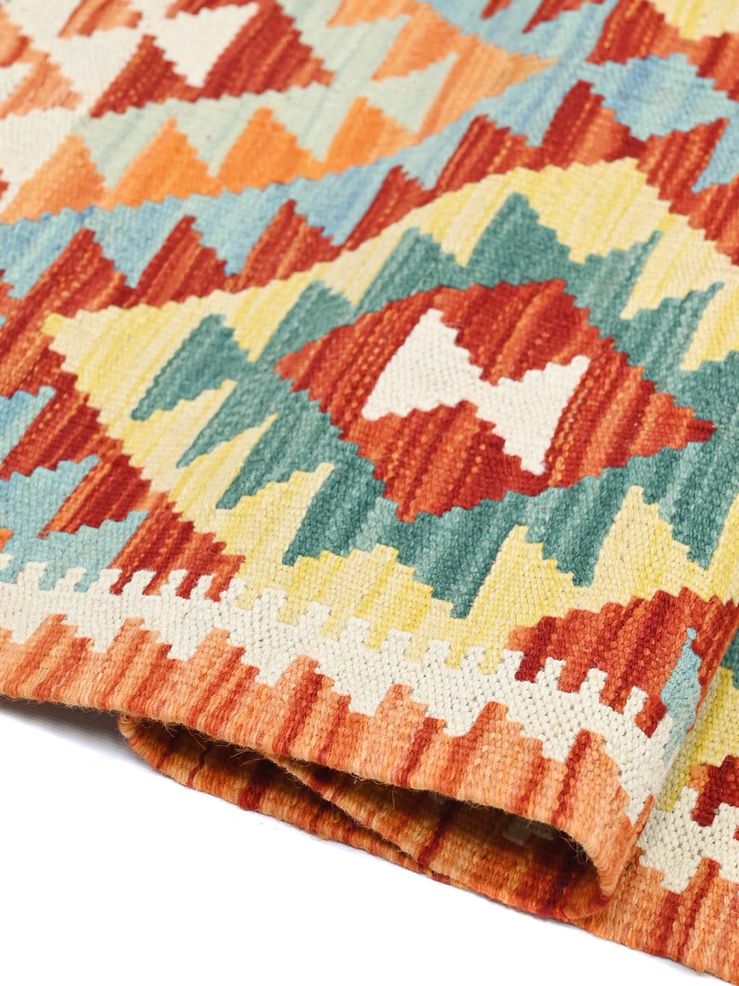Hand-woven Afghan runner with vibrant geometric diamond motifs in multicolor Wool.