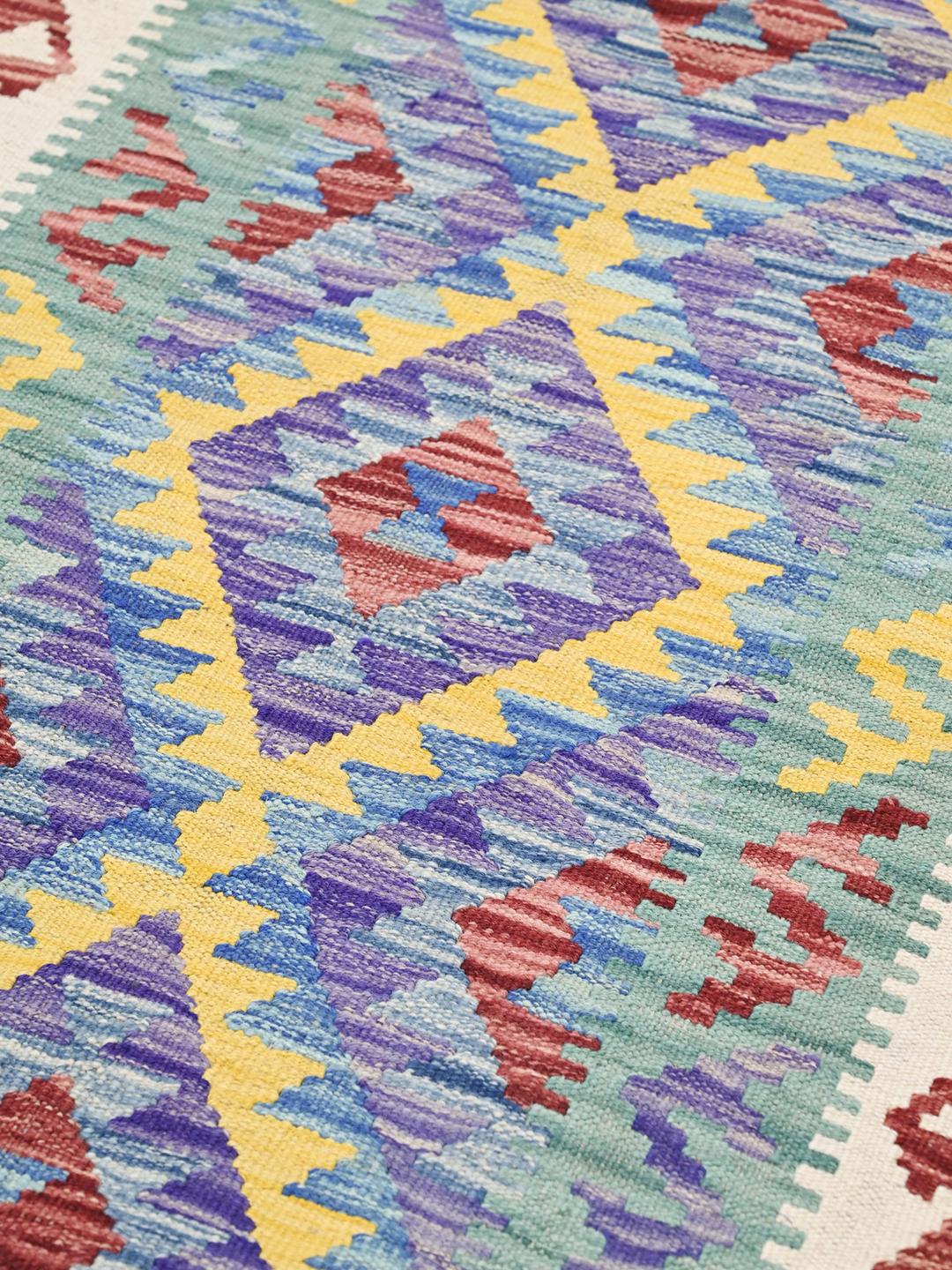 Hand-woven Afghan runner with vibrant geometric patterns in multicolor Wool