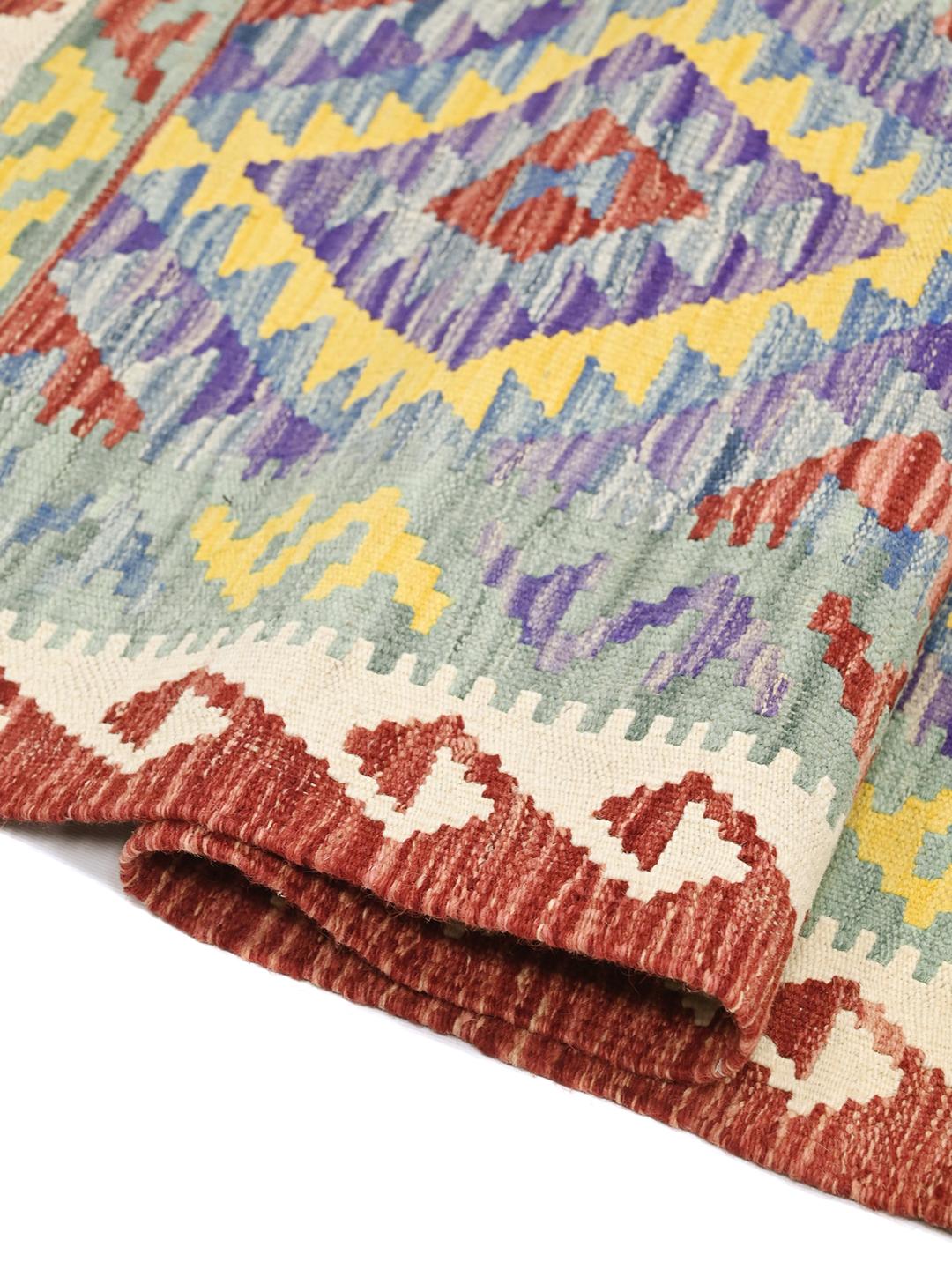 Hand-woven Afghan runner with vibrant geometric patterns in multicolor Wool