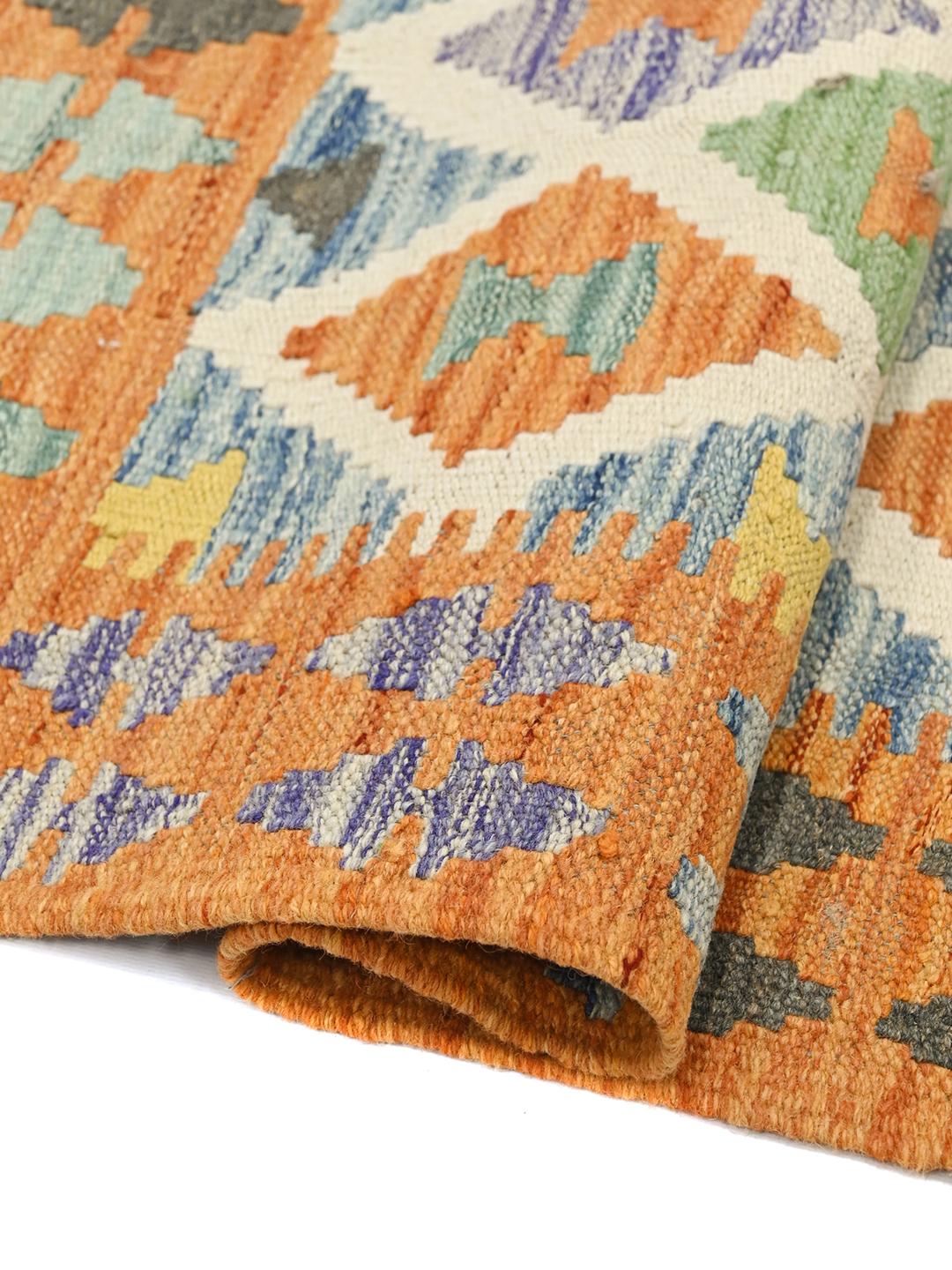 Hand-woven Afghan Kelim rug with a vibrant geometric diamond pattern in multicolor Wool