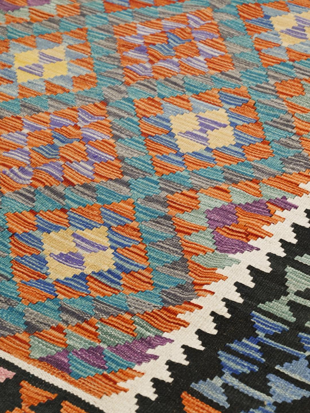 Hand-woven Afghan Kelim rug with geometric patterns in multicolor wool